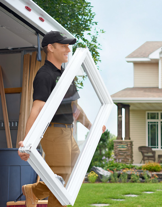 Renewal Al exiting truck with white picture window in hands